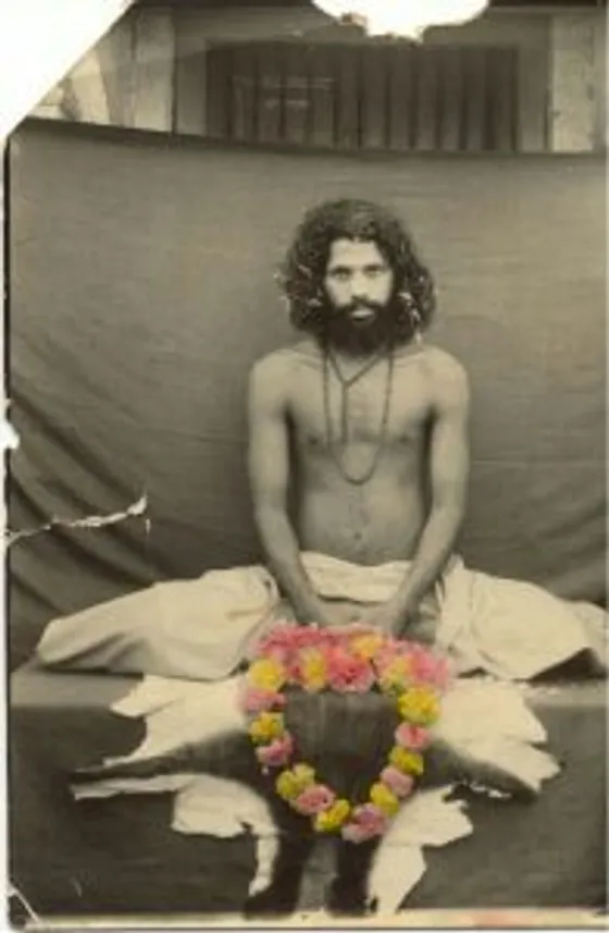 A young Gurudev seated in meditation during his early years of tapasya