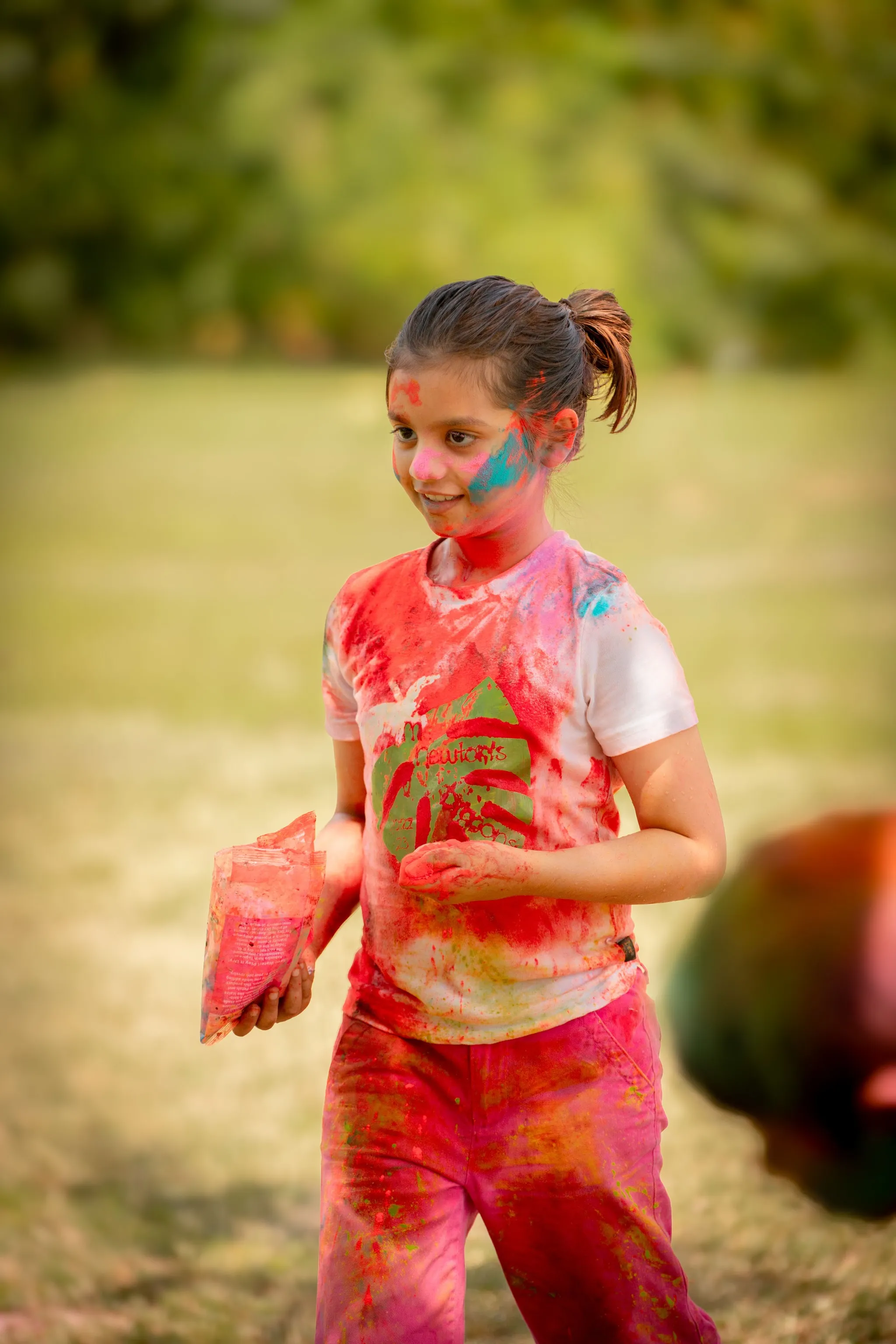 Devotees of all ages celebrating Holi together at the temple