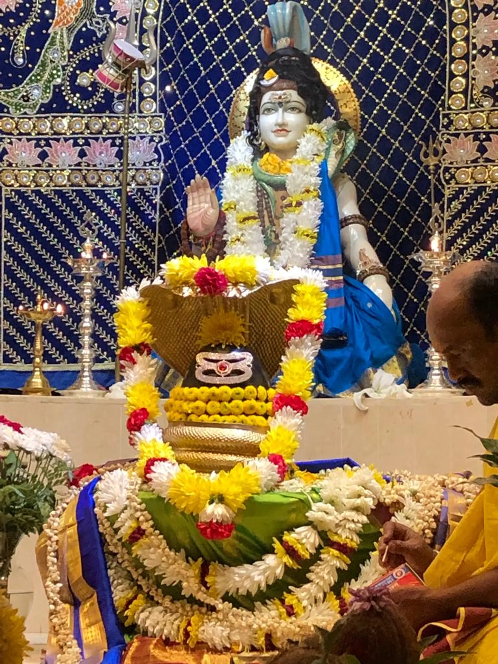 The temple's Shiva lingam, decorated for worship